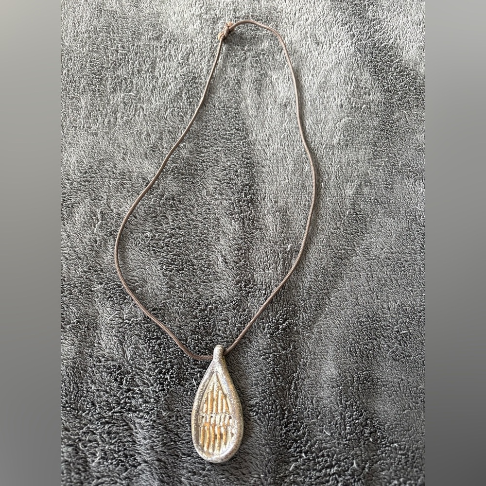 2/$20 Pottery pendant on adjustable braided shoelace necklace.